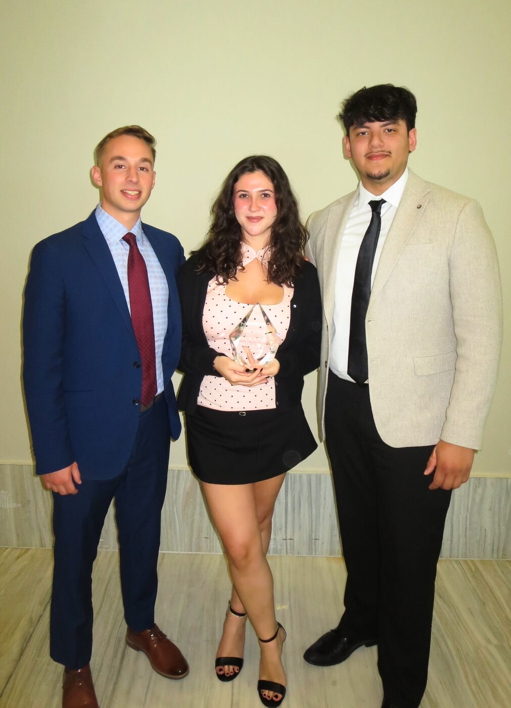Risin Enterprises team members celebrating an award win