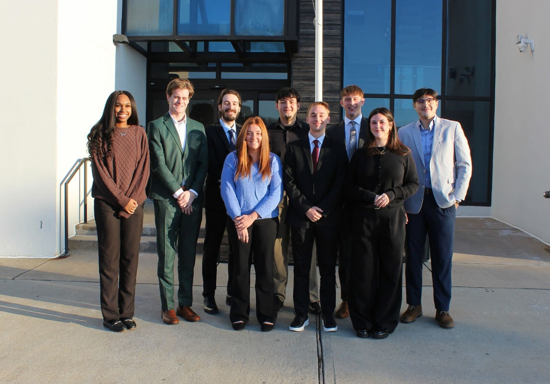 Risin Enterprises team in professional attire